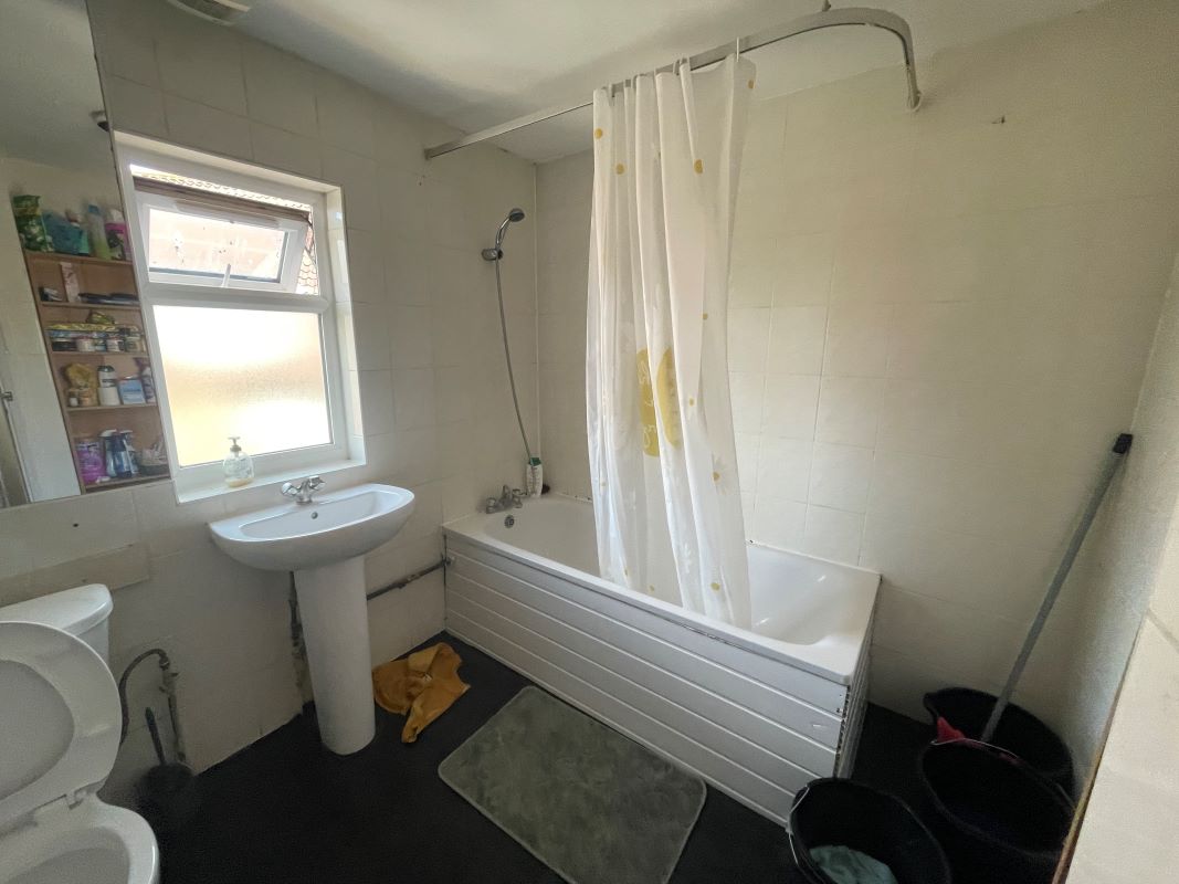FREEHOLD MIXED USE INVESTMENT - SHOP & TWO FLATS - PRODUCING £40,200 P.A.